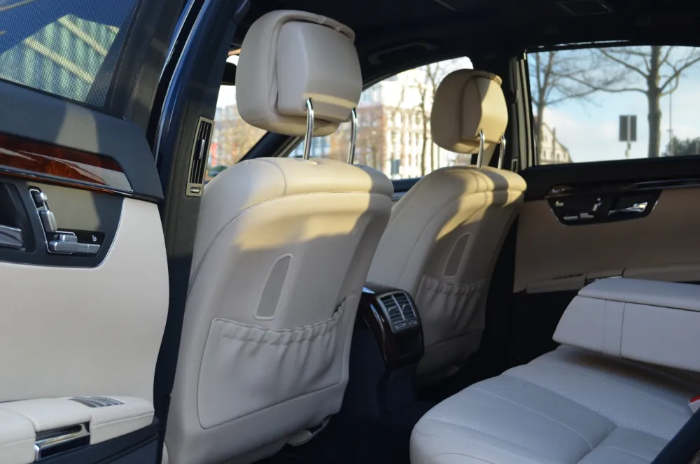 Spacious leather rear cabin of an executive chauffeur car used for efficient corporate travel in London